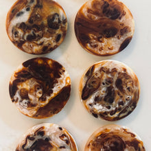 Load image into Gallery viewer, Marbled brown and white cookies arranged in a grid on a light background