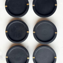 Load image into Gallery viewer, black wood coaster with brass inlay
